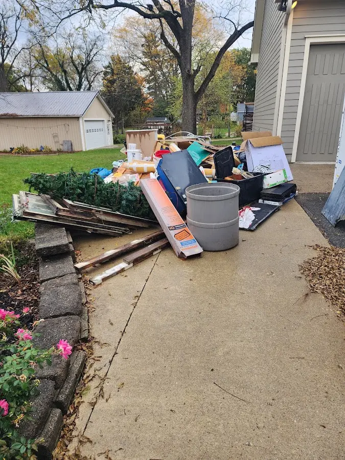 Dumpster being loaded with debris for 12 Yard Dumpster Rental in Norridge